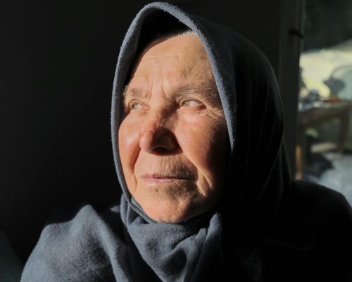 Close up of a serene face with soft warm lighting